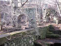Stone arches that formerly supported bridge over creek. Photo by Daniel Chazin.